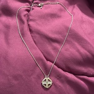 18 inch necklace. Sterling silver. Charm open up to 3 hearts.